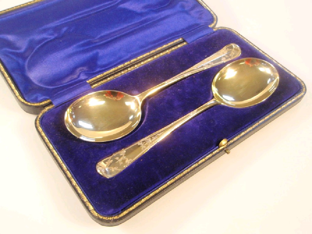 Appraisal: A pair of Edwardian silver gilt serving spoons with rat