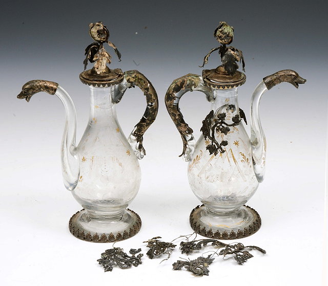 Appraisal: A PAIR OF CONTINENTAL PROBABLY GERMAN SILVER MOUNTED GLASS EWERS