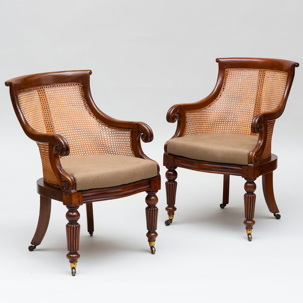 Appraisal: Pair of Late Regency Carved Mahogany and Caned Armchairs Fitted