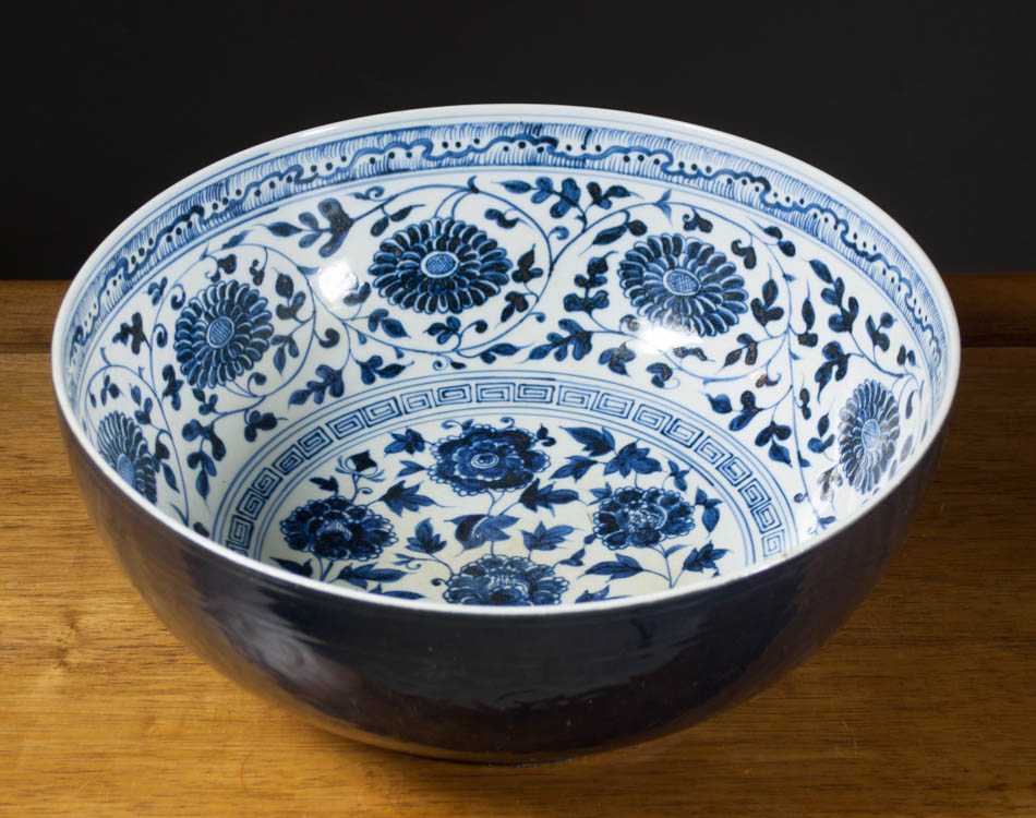 Appraisal: CHINESE BLUE AND WHITE PORCELAIN CENTERPIECE BOWL having incised vining