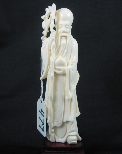 Appraisal: A CHINESE CARVED IVORY FIGURE of a wise old sage