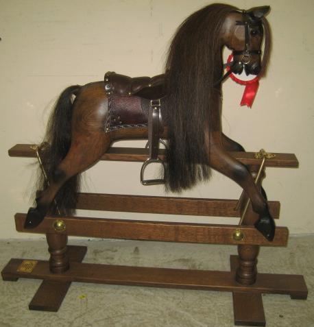 Appraisal: A late th century dark oak rocking horse by White