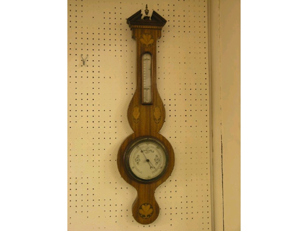 Appraisal: An early th century inlaid mahogany wheel barometer with break-arch