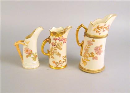 Appraisal: Group of three Royal Worcester porcelain gilt decorated ewers Each