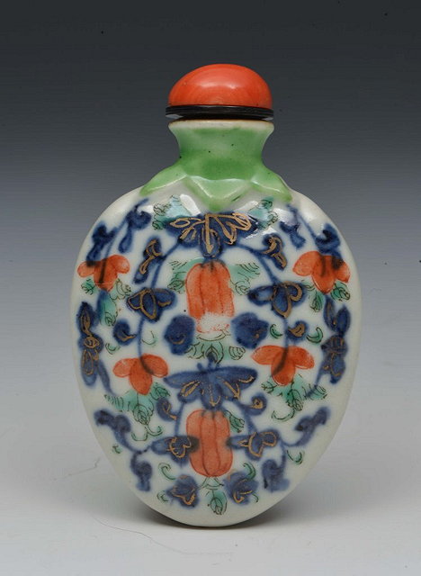 Appraisal: A CHINESE PORCELAIN SNUFF BOTTLE of flattened oviform fluted and