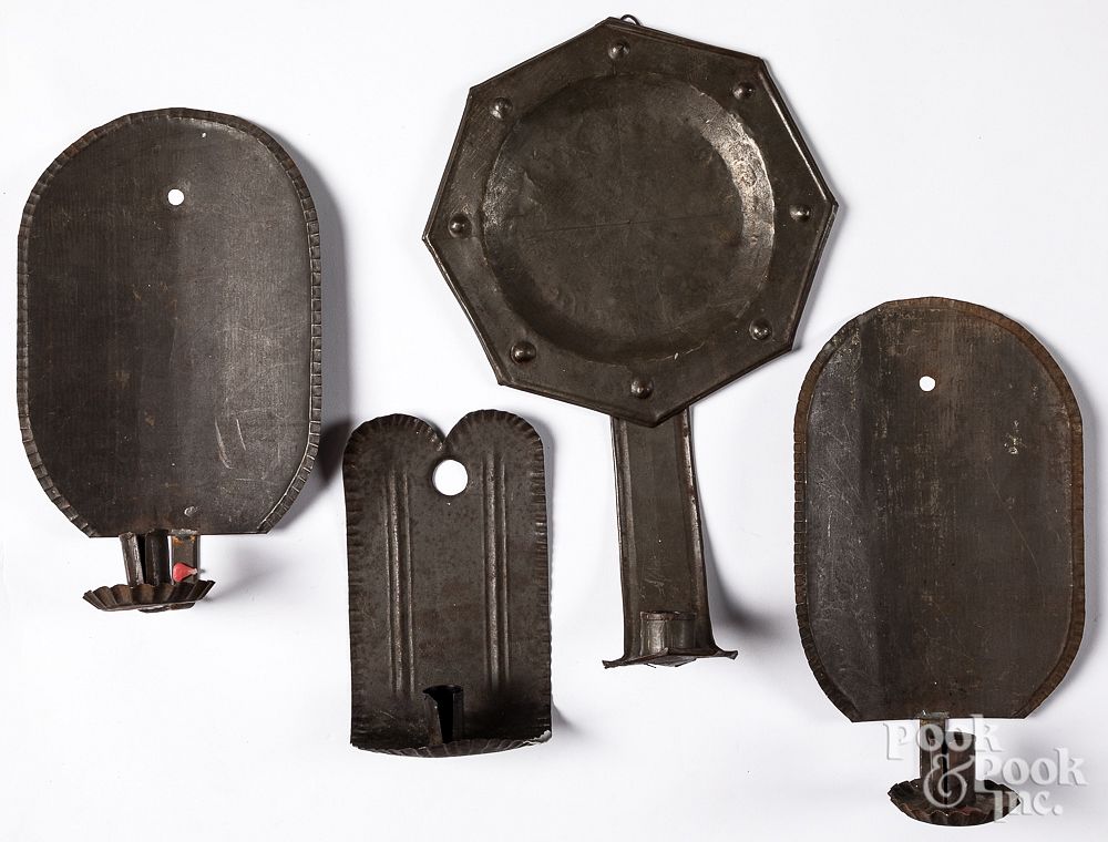 Appraisal: Four tin sconces th early th c Four tin sconces