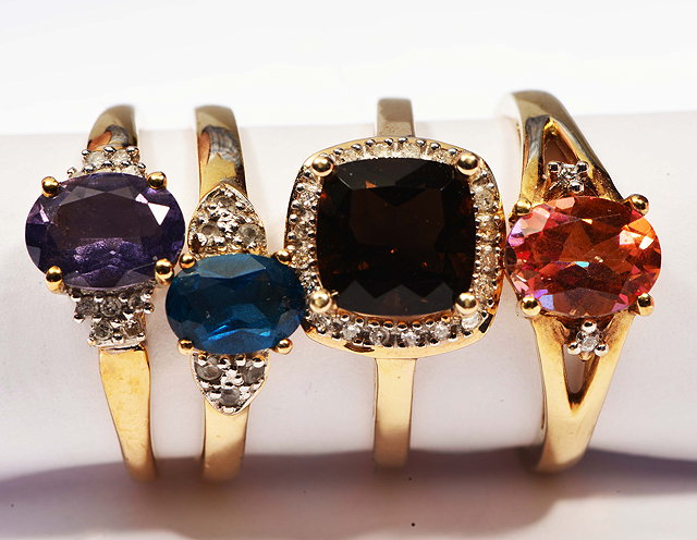 Appraisal: FOUR VARIOUS CT GOLD RINGS set with semi-precious stones