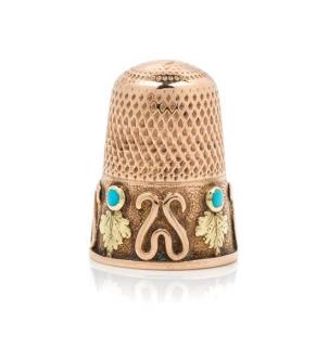 Appraisal: A Bi-Colored Gold and Turquoise Thimble the knurled top and