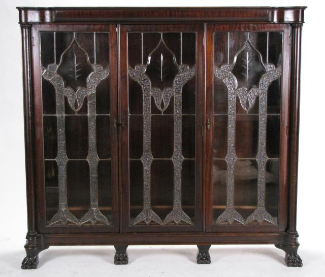 Appraisal: Circa mahogany triple bookcase with later-added leaded beveled glass door