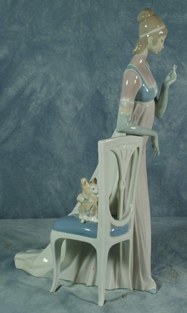 Appraisal: Lladro figurine of a woman with puppy on chair no