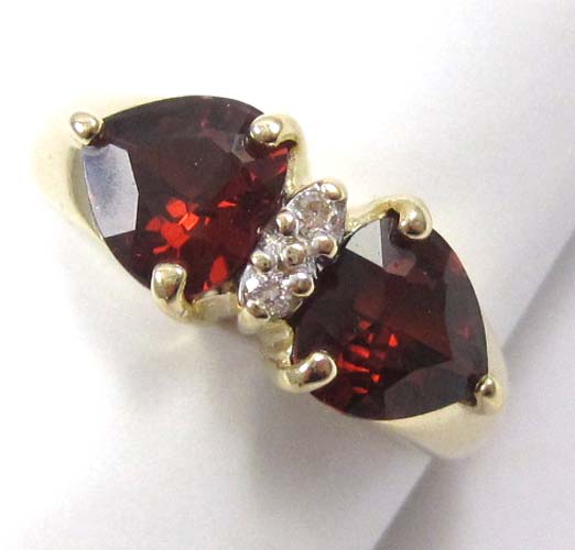 Appraisal: GARNET DIAMOND AND FOURTEEN KARAT GOLD RING set with two