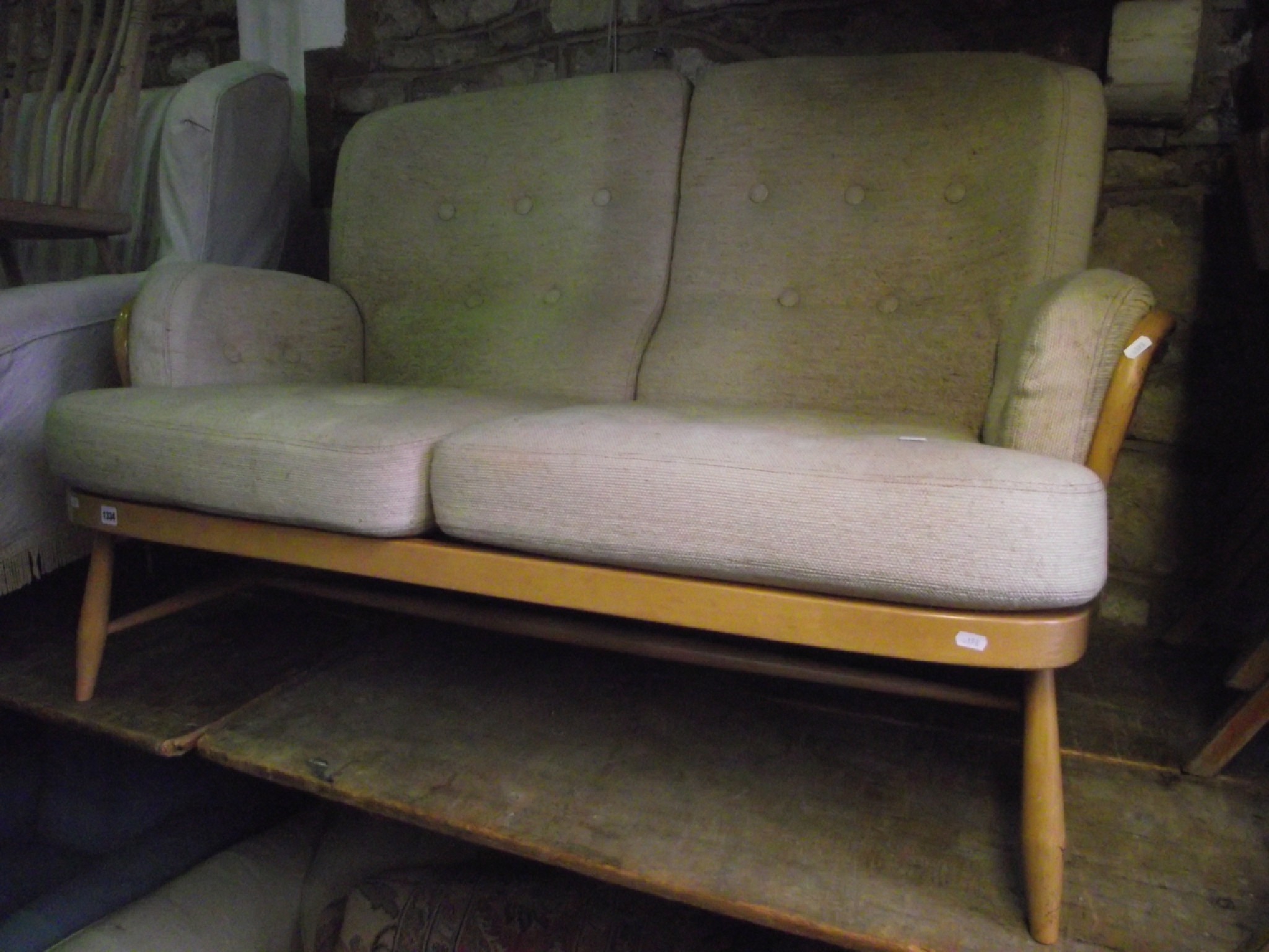 Appraisal: An Ercol two seat sofa with light beechwood frame and