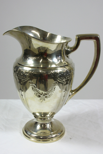 Appraisal: AMERICAN STERLING SILVER HEAVY PITCHER chased and engraved with garlands