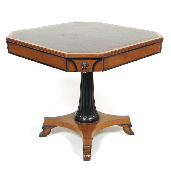 Appraisal: A Regency style ebonized and leather topped games table height