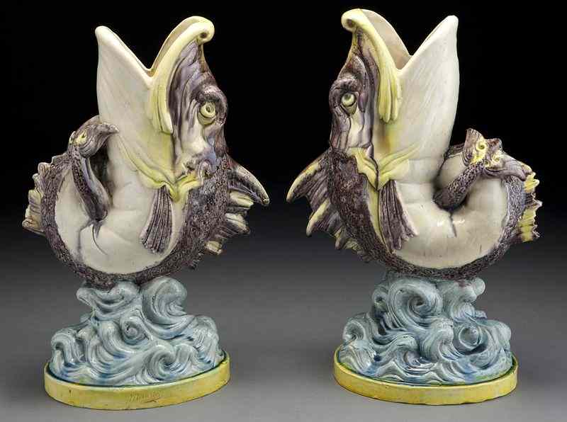 Appraisal: Pr Francois Maurice majolica gurgling fish vases each depicting a