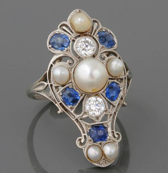 Appraisal: An Art Deco cultured pearl sapphire diamond and platinum shield