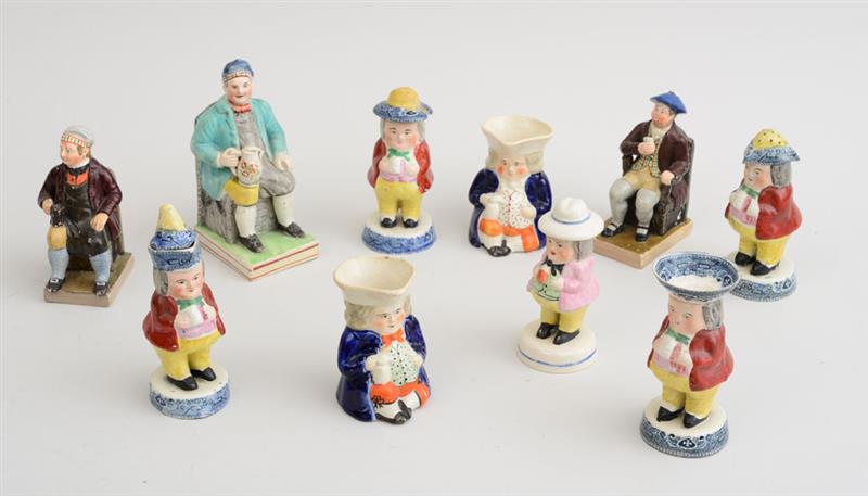 Appraisal: THREE ENGLISH PEARLWARE FIGURES OF SEATED TOPPERS AND SEVEN OTHER