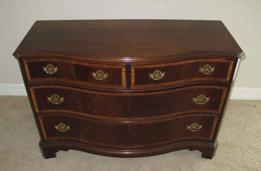 Appraisal: HICKORY AMERICAN MASTERPIECE DRESSER Chippendale style serpentine front banded mahogany