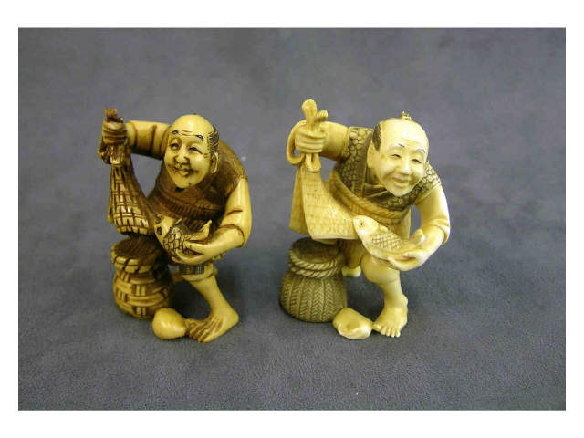 Appraisal: Two signed ivory netsuke both depicting fisherman with a fish