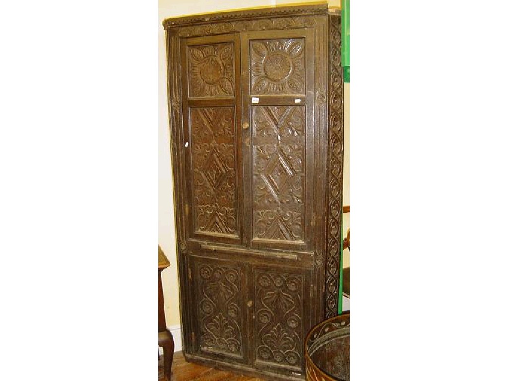 Appraisal: A Victorian oak freestanding corner cupboard enclosed by two pairs