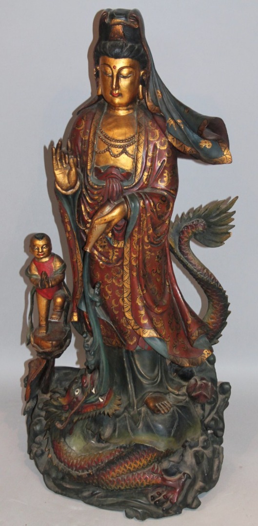 Appraisal: A Chinese carved wooden figure group of a lady in