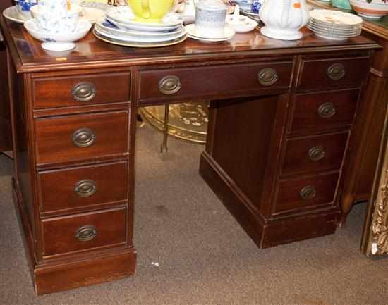 Appraisal: Georgian style mahogany kneehole desk with inset tooled leather top