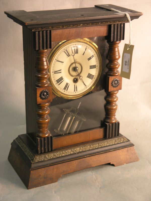 Appraisal: A Junghans mantel clock in walnut and beech case with