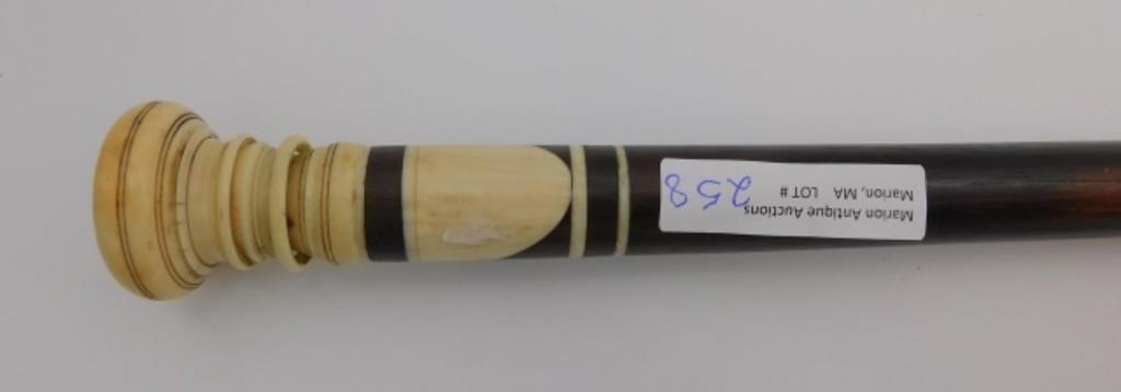 Appraisal: Ebony shaft unusual ring carving on handle with abalone inlay