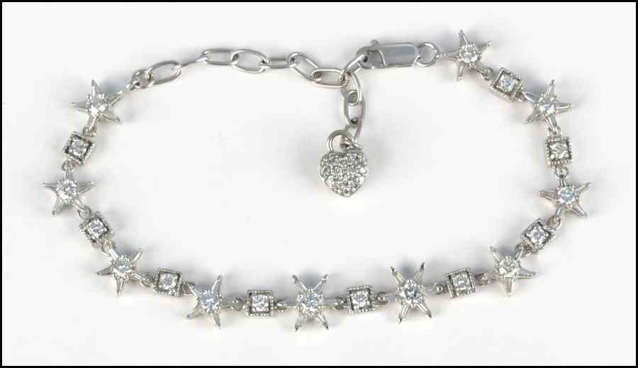 Appraisal: KARAT WHITE GOLD DIAMOND STAR BRACELET Round and baguette diamonds