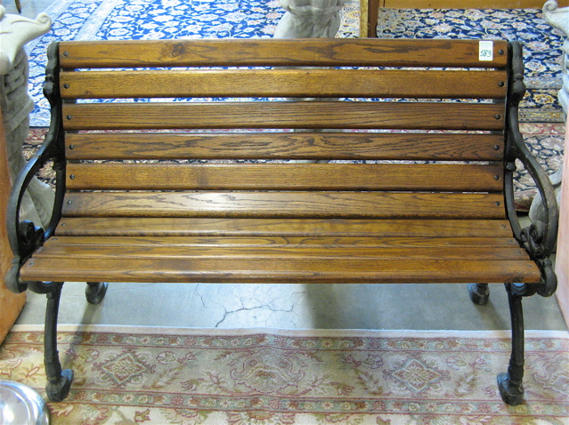 Appraisal: AN OAK AND CAST METAL PARK BENCH American th century