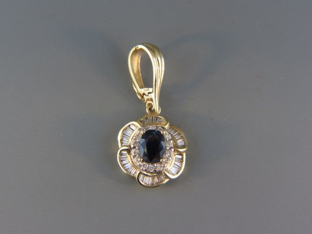 Appraisal: Sapphire and Diamond Pendant deep rich blue oval gem weighing