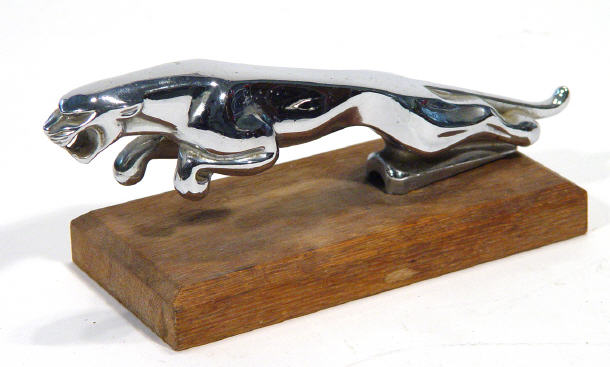 Appraisal: Chrome Jaguar car mascot on a mahogany base cm in