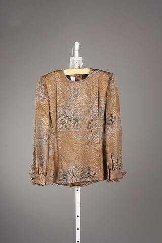 Appraisal: Andr Laug brown animal print long sleeve silk blouse Size