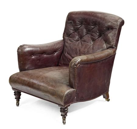 Appraisal: VICTORIAN LEATHER UPHOLSTERED ARMCHAIR CIRCA covered in buttoned brown leather