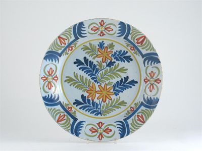 Appraisal: A Delftware dish painted in polychrome enamels with a pattern