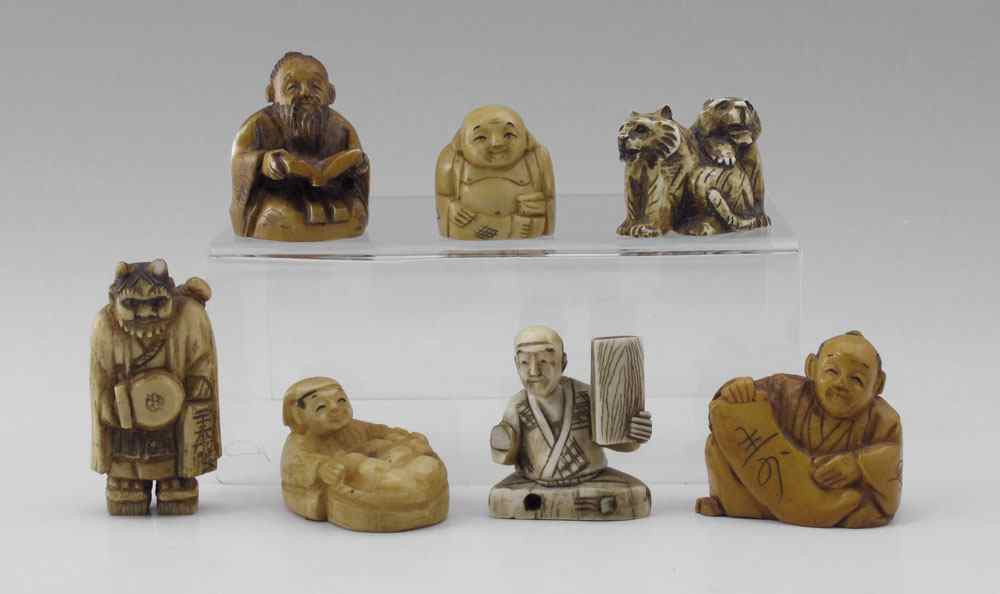 Appraisal: PIECE CARVED IVORY NETSUKE To include Man seated with scroll