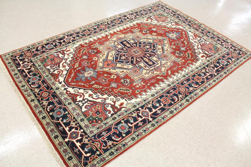 Appraisal: HAND KNOTTED ORIENTAL CARPET Persian Serapi or Heriz design centering