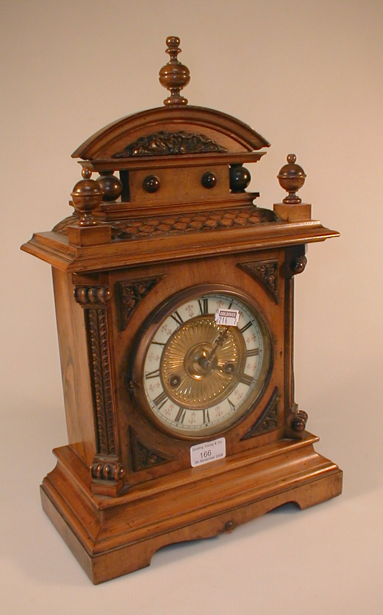 Appraisal: A thC walnut cased eight-day mantel clock