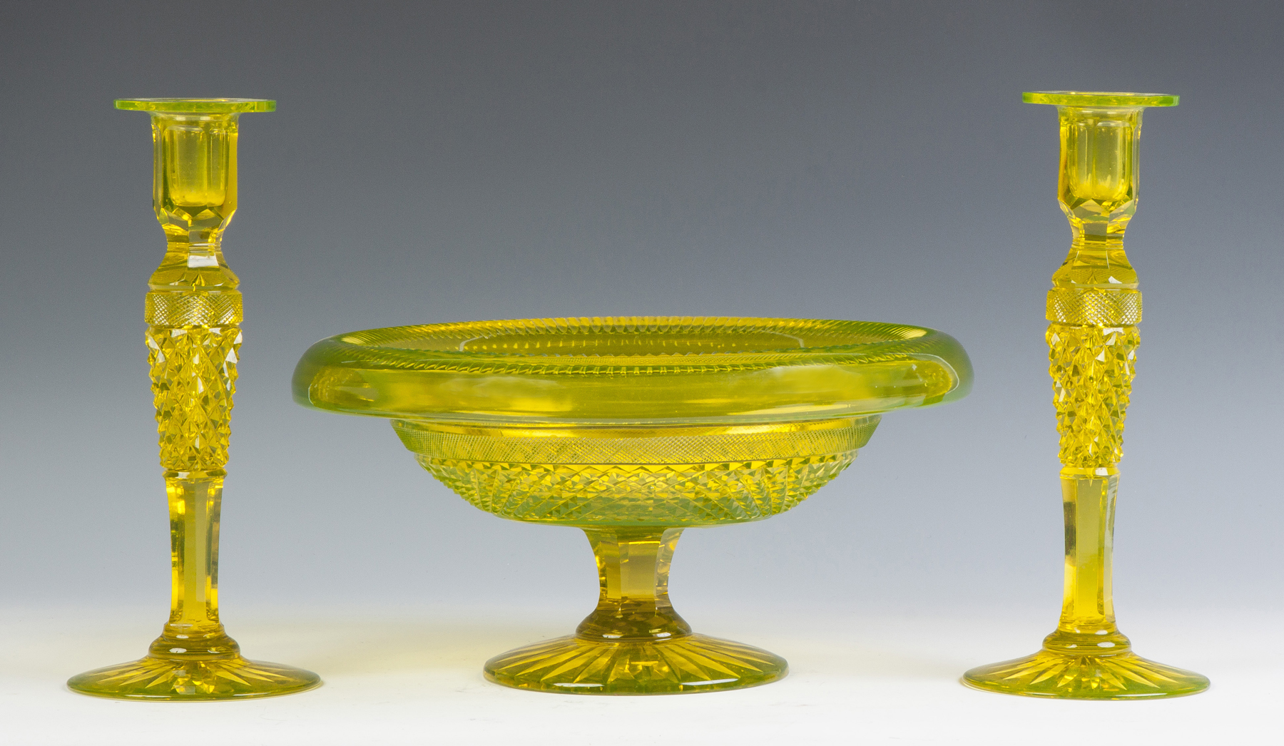 Appraisal: Cut Glass Vaseline Color Compote Matching Candlesticks th cent