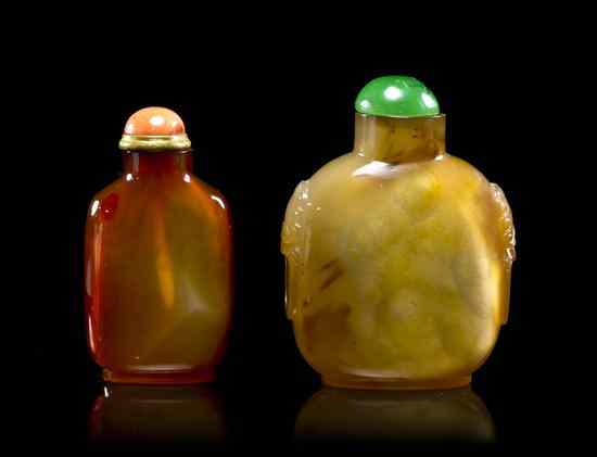 Appraisal: Two Carved Agate Snuff Bottles comprising one compressed globular bottle