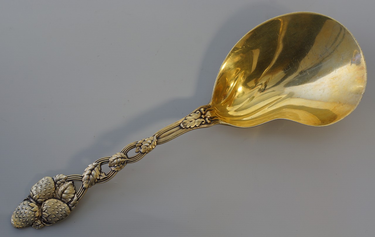 Appraisal: Tiffany Co sterling silver strawberry pattern serving spoon vermeil bowl