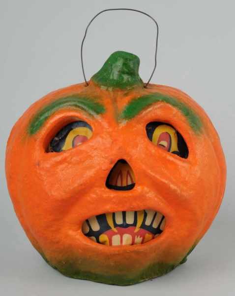 Appraisal: American Pulp Grimacing Jack-O-Lantern Description With green stem original paper