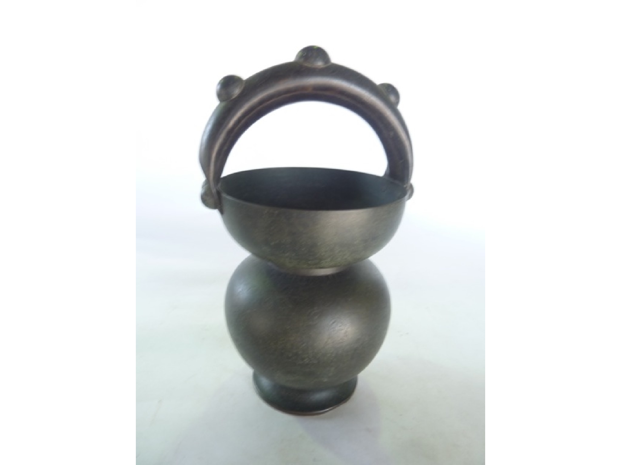 Appraisal: An unusual eastern beaten and raised bronze vessel of gourd