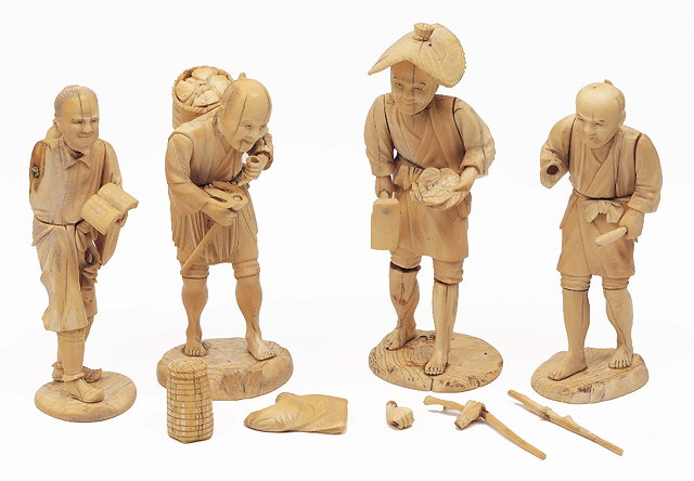 Appraisal: Four Japanese sectional ivory standing figuresMeijithree with gardening implements and