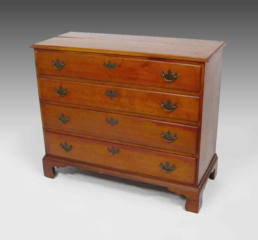 Appraisal: A DIMINUTIVE COUNTRY CHIPPENDALE CHEST Four graduated drawers bracket base