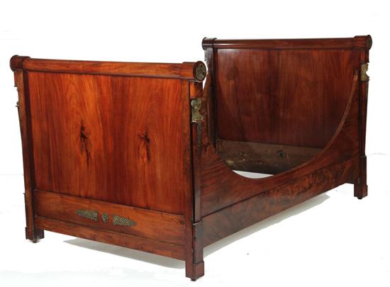 Appraisal: EMPIRE BED France st quarter- th century mahogany Rounded crests