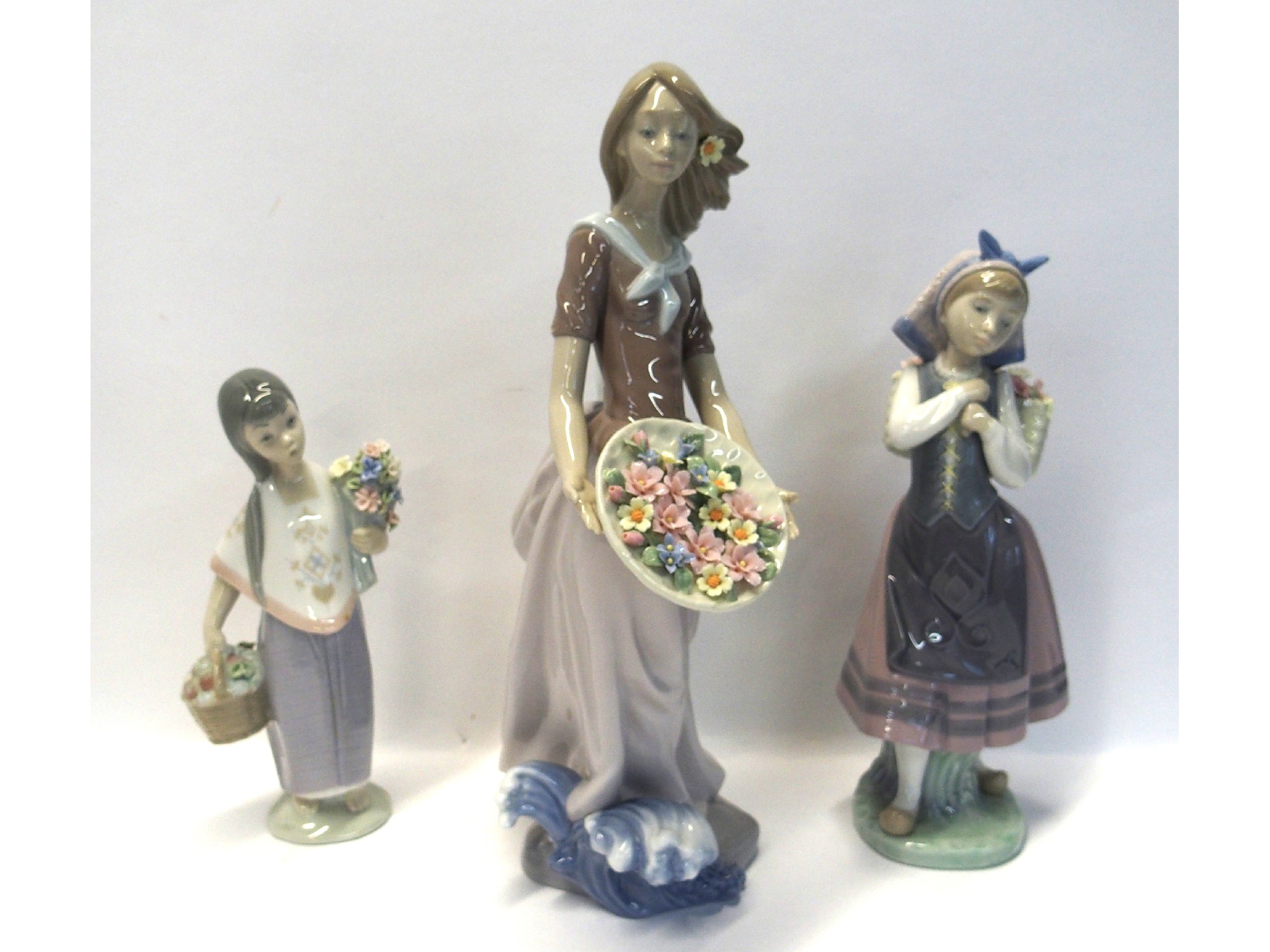 Appraisal: Three Lladro figures of girls including Ocean Offering by Salvadore