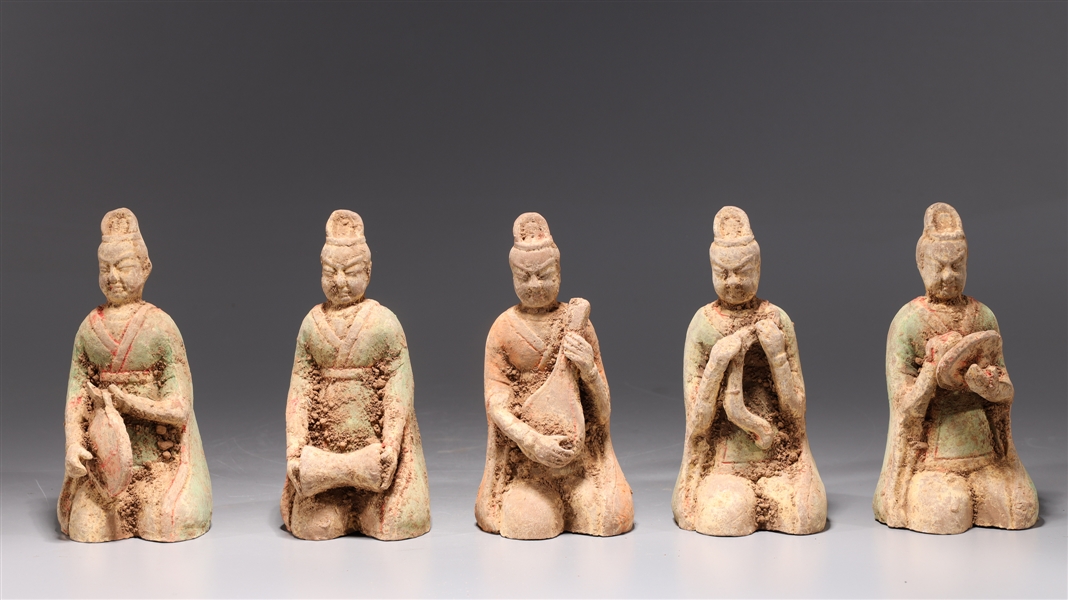 Appraisal: Group of four early style ceramic musician figures in green