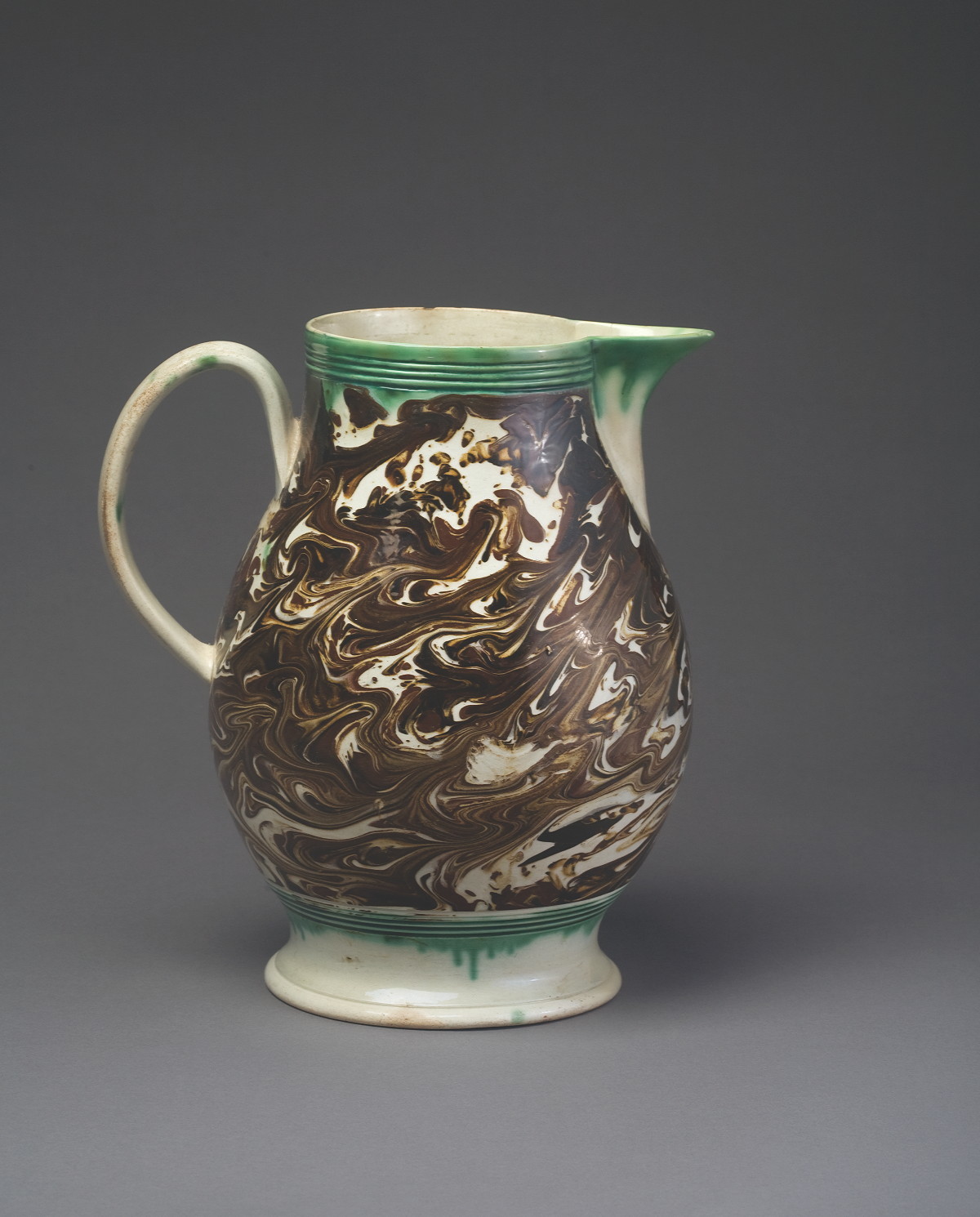 Appraisal: BRITISH PEARLWARE MOCHAWARE JUG CIRCA - Of baluster form slip-marbled