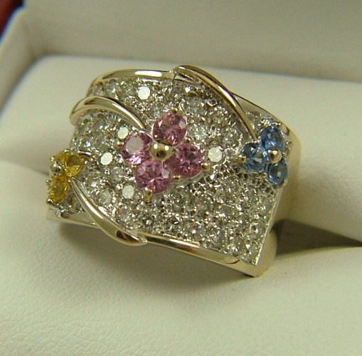 Appraisal: COLORED SAPPHIRE AND DIAMOND RING K white gold with four